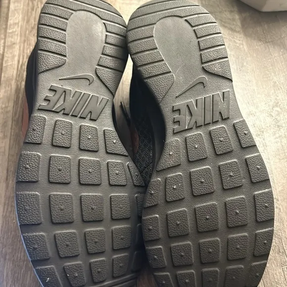 Nike Black and gold tandem running shoes