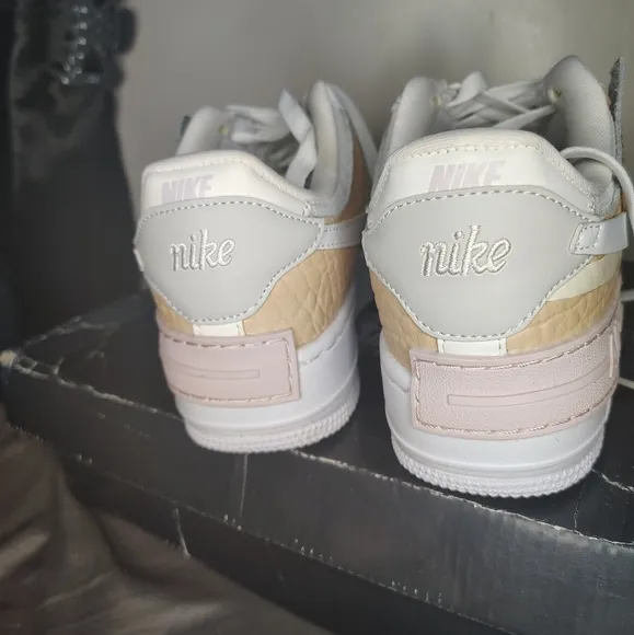 Nike White and Tan Athletic Shoes with Iconic Air Force 1 Design